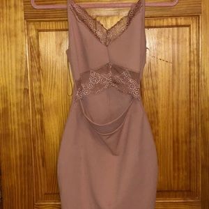 Light pink dress with lace detail and slit